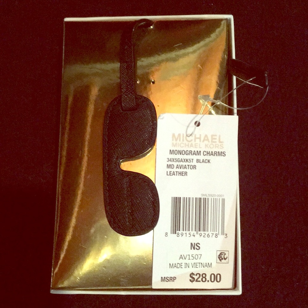 Micheal Kors monogram charms “ mk aviator